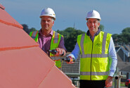 Abel Homes managing director Paul LeGrice right and site manager John Bright top out the new home at Swaffham 500px