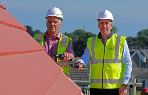 Abel Homes managing director Paul LeGrice right and site manager John Bright top out the new home at Swaffham 500px