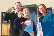 Ashley Rees and Georgia Reeve receive their keys from Clare Cornish right of Abel Homes sm