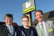 Cllr Colin Houghton Elliot Clark and Tony Abel in front of the new village sign at Swans Nest in Swaffham sm