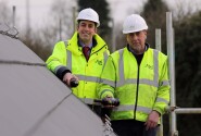 Paul Legrice left and Alan Read of Abel Homes perform the traditional topping out ceremony at Little Melton sm